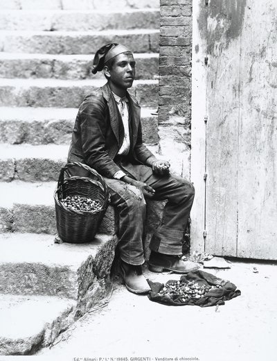 Sea-snail vendor in traditional dress, in Girgenti by Italian Photographer